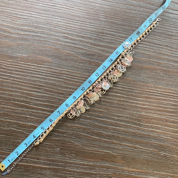 Nygard necklace intertwined with ribbon and silver and pink bangles. - Picture 5 of 6